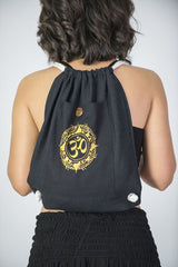 Ohm Drawstring Cotton Canvas Backpack in Gold on Black